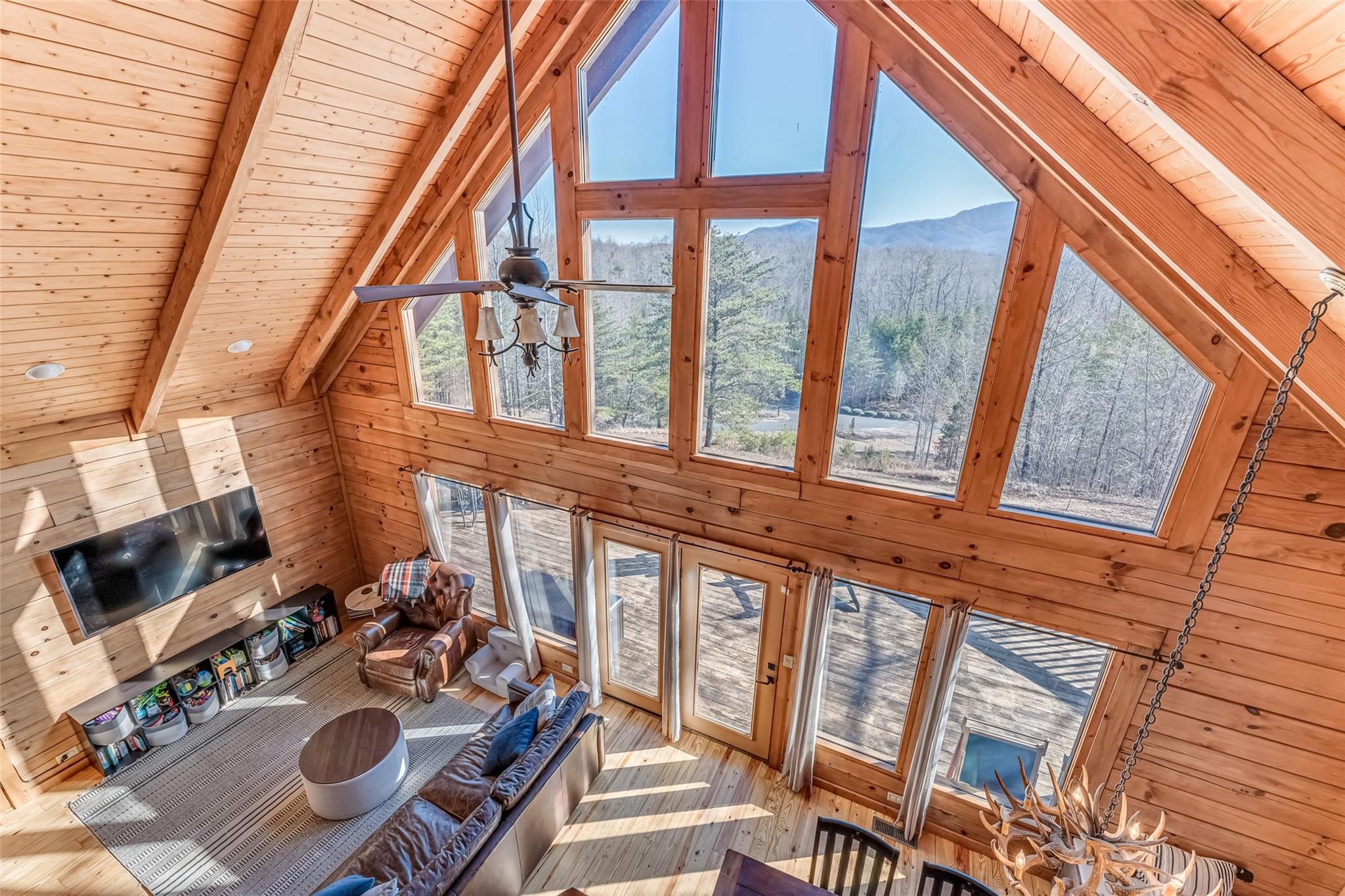 61 North Boundary Rd Mill Spring Mill Spring, NC 28756 - Photo 34 of 46 a view of a patio with couches table and chairs and potted plants