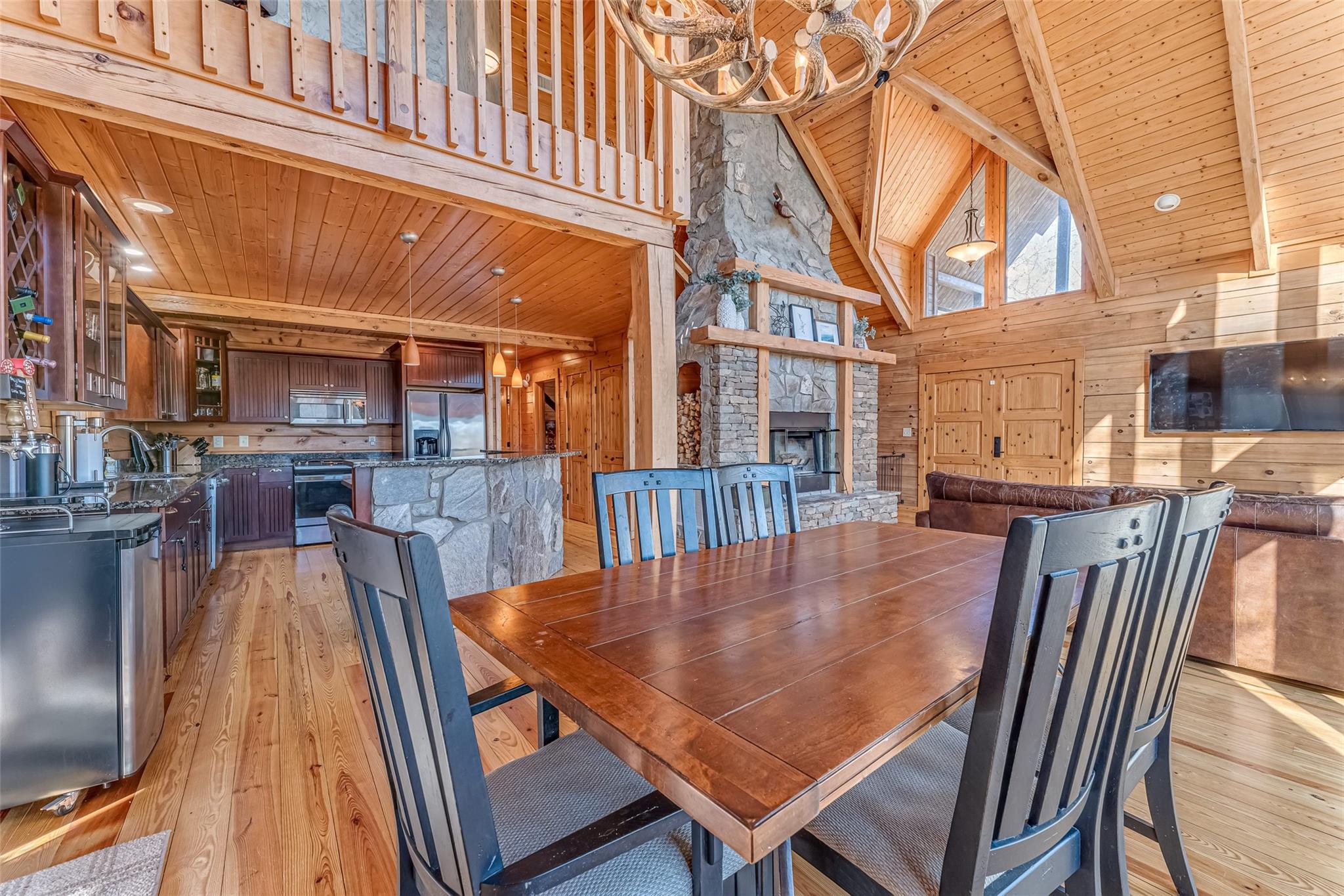 61 North Boundary Rd Mill Spring Mill Spring, NC 28756 - Photo 7 of 46 a view of a patio with table and chairs with wooden floor and fence