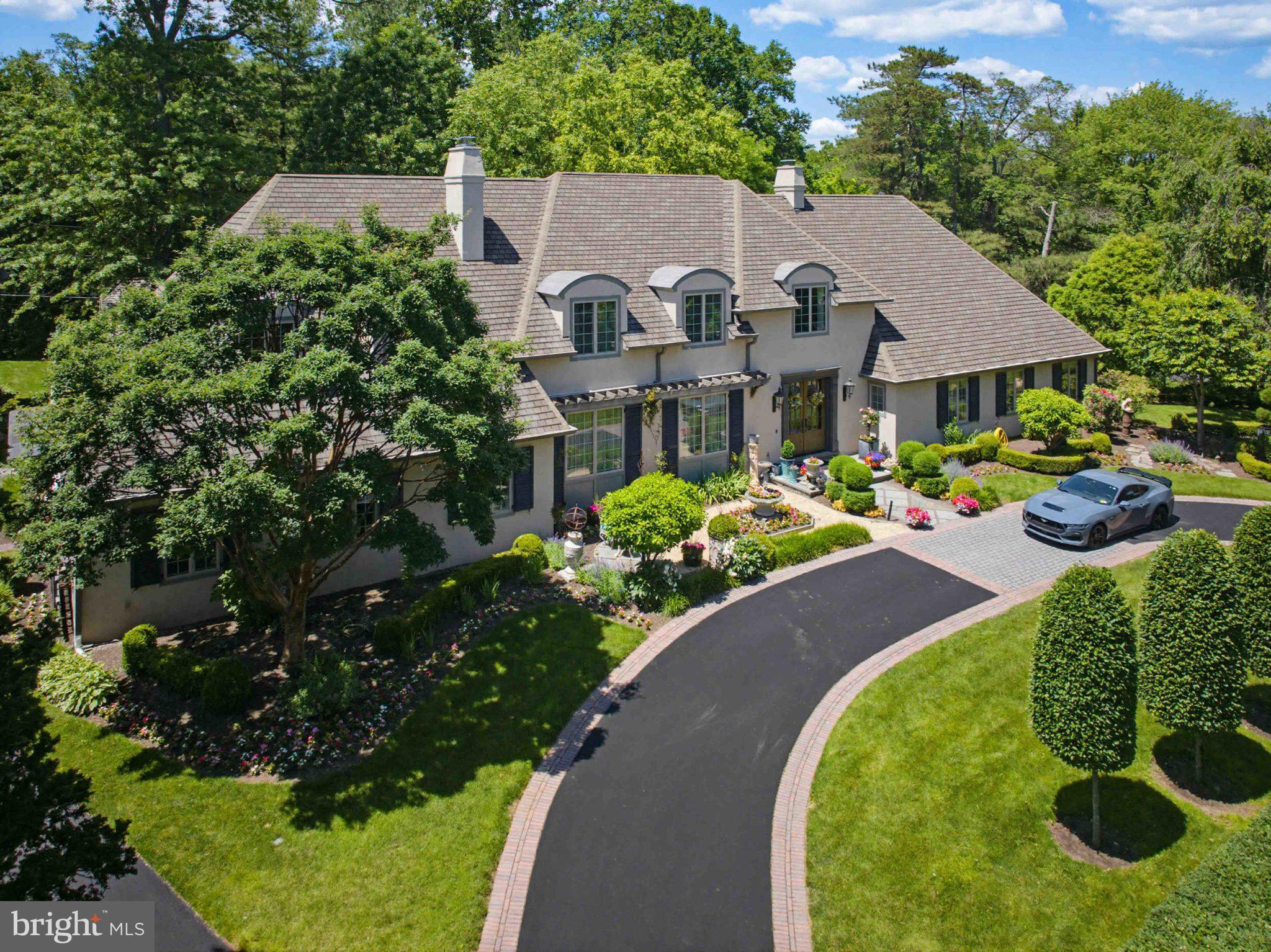 2244 Deer Path Road Huntingdon Valley, PA 19006 - Photo 1 of 95 Elegant home with lush landscaping.