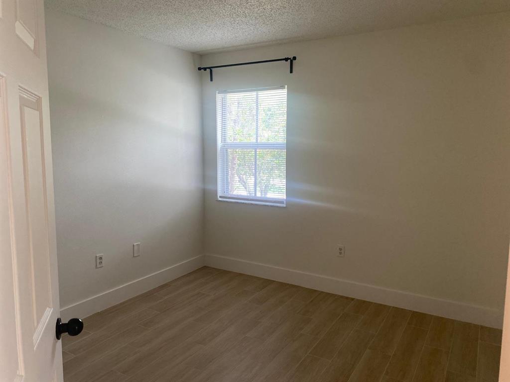 2457 Centergate Drive, Unit 302 Miramar, FL 33025 - Photo 6 of 10 an empty room with a window