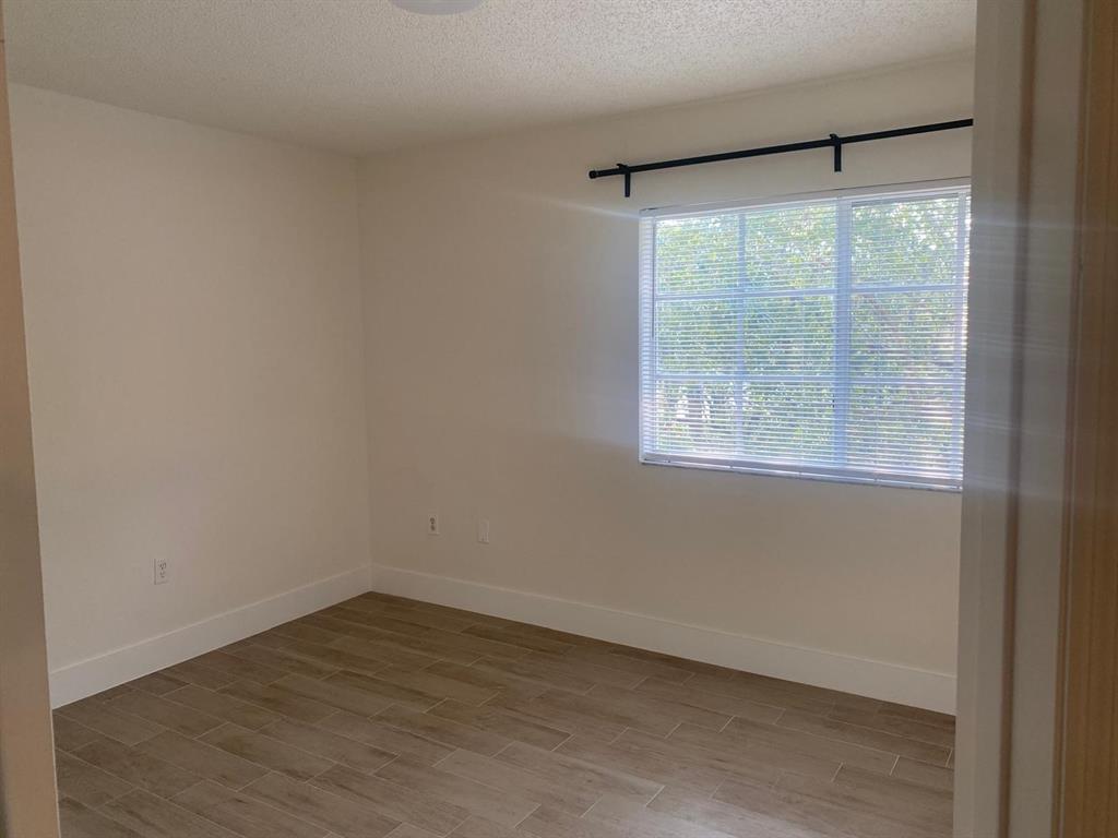 2457 Centergate Drive, Unit 302 Miramar, FL 33025 - Photo 10 of 10 an empty room with a window