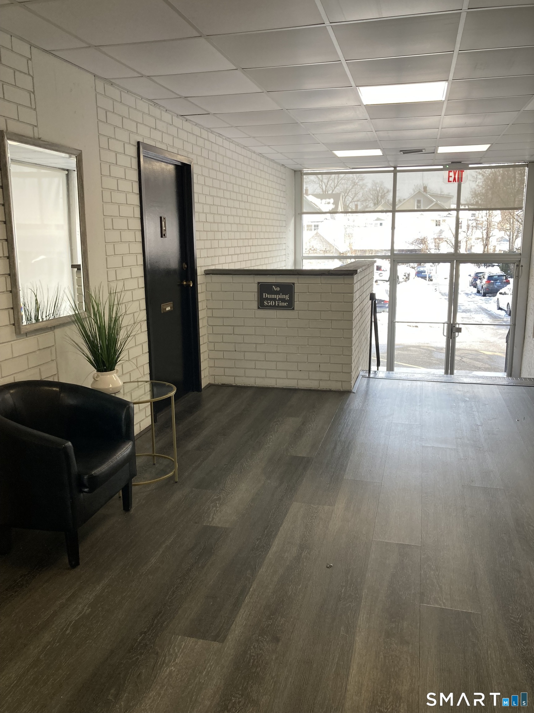 87 Glenbrook Road, Unit 6E Stamford, CT 06902 - Photo 13 of 23 a living room with furniture and a large window