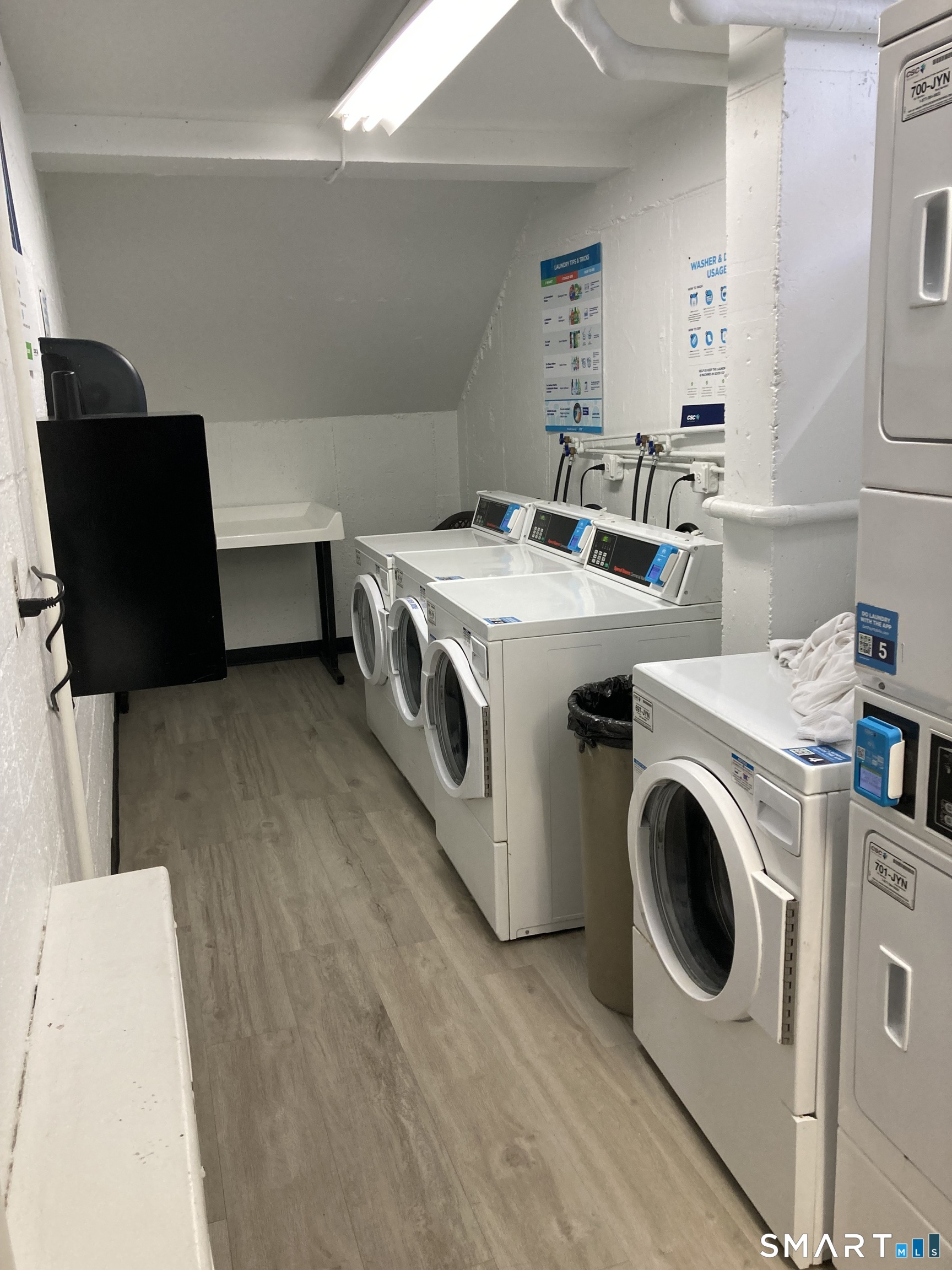 87 Glenbrook Road, Unit 6E Stamford, CT 06902 - Photo 17 of 23 a utility room with dryer and washer