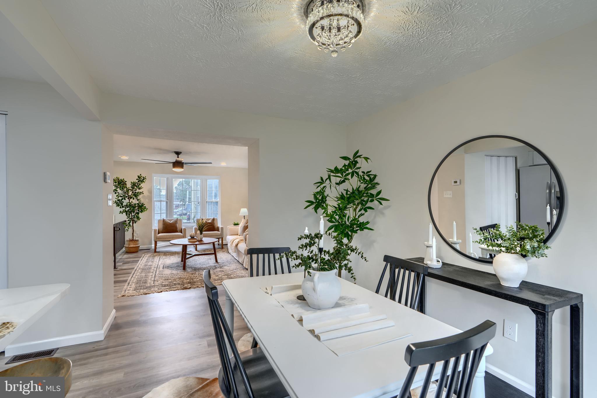 4008 Rustico Road Baltimore, MD 21220 - Photo 10 of 37 a view of a dining room with furniture window and wooden floor