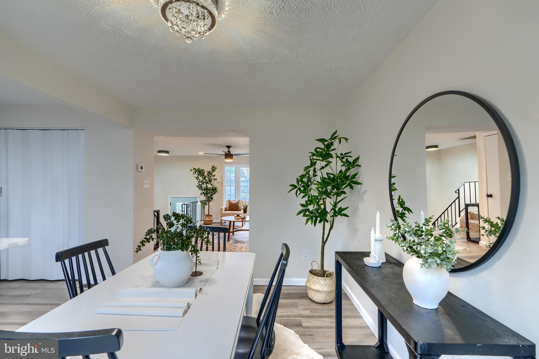 4008 Rustico Road Baltimore, MD 21220 - Photo 9 of 37 a view of a dining room with furniture and wooden floor