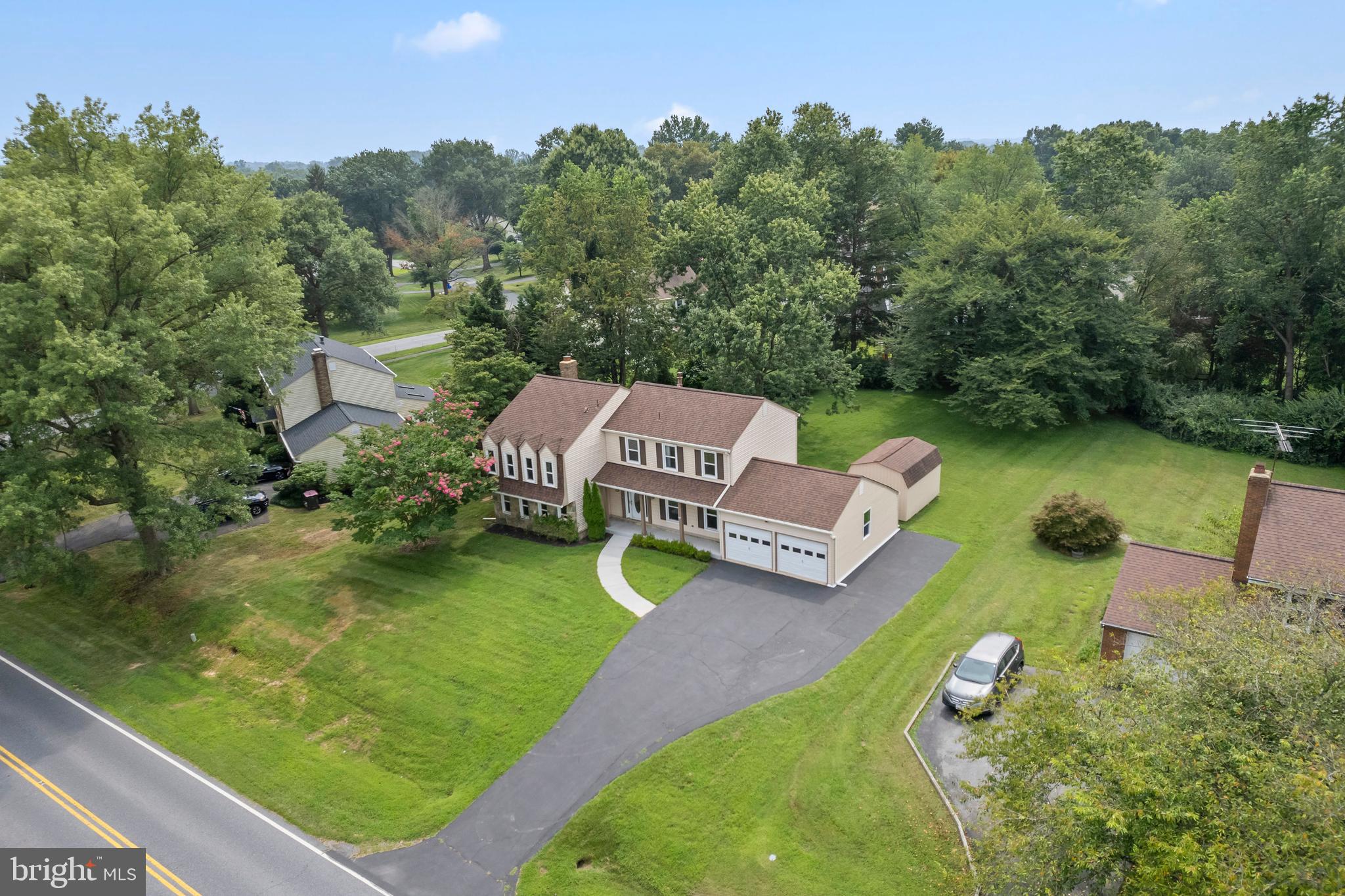 an aerial view of a house with outdoor space swimming pool