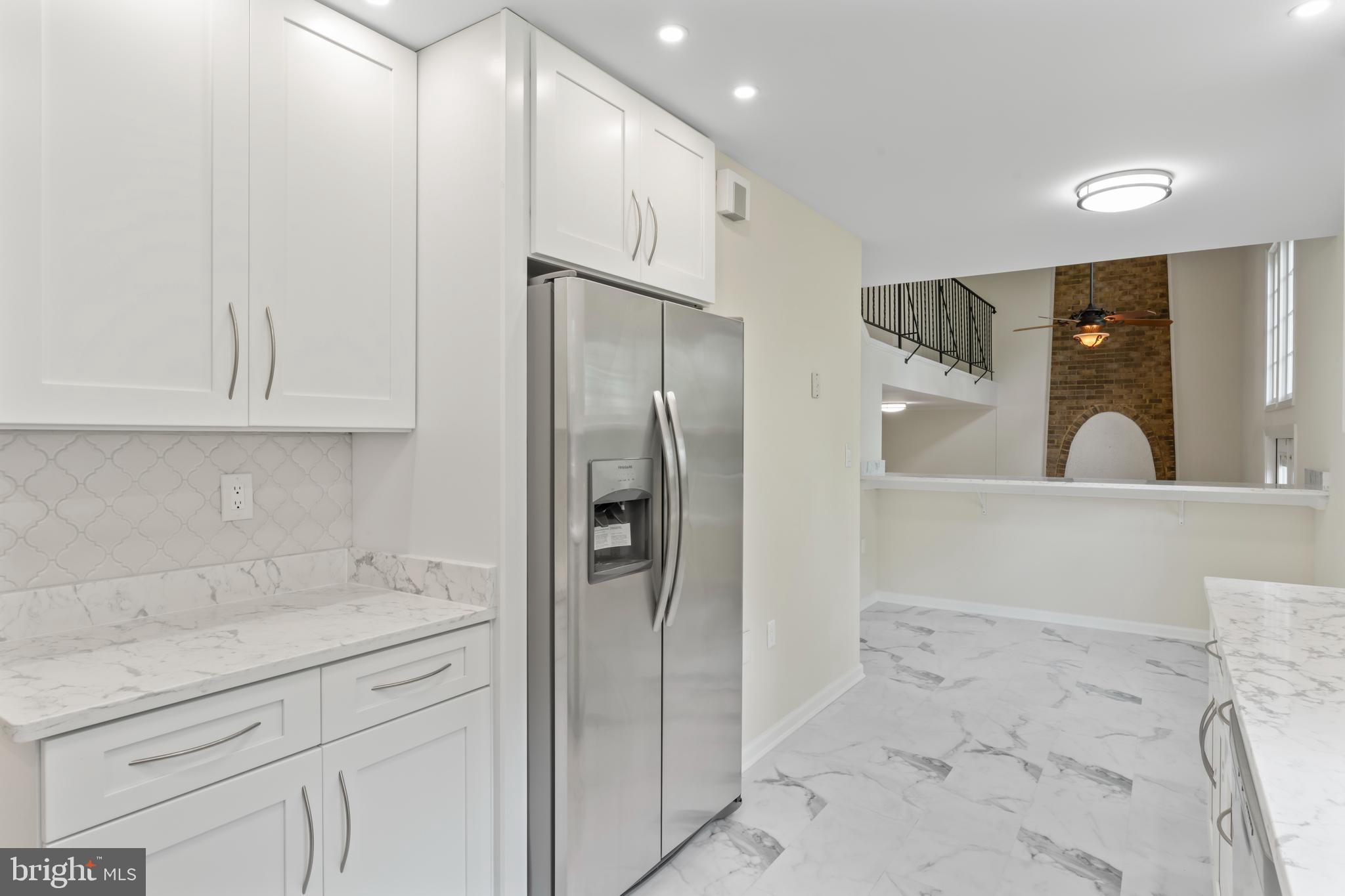 17004 Cashell Road Rockville, MD 20853 - Photo 15 of 80 a kitchen with stainless steel appliances a refrigerator and cabinets