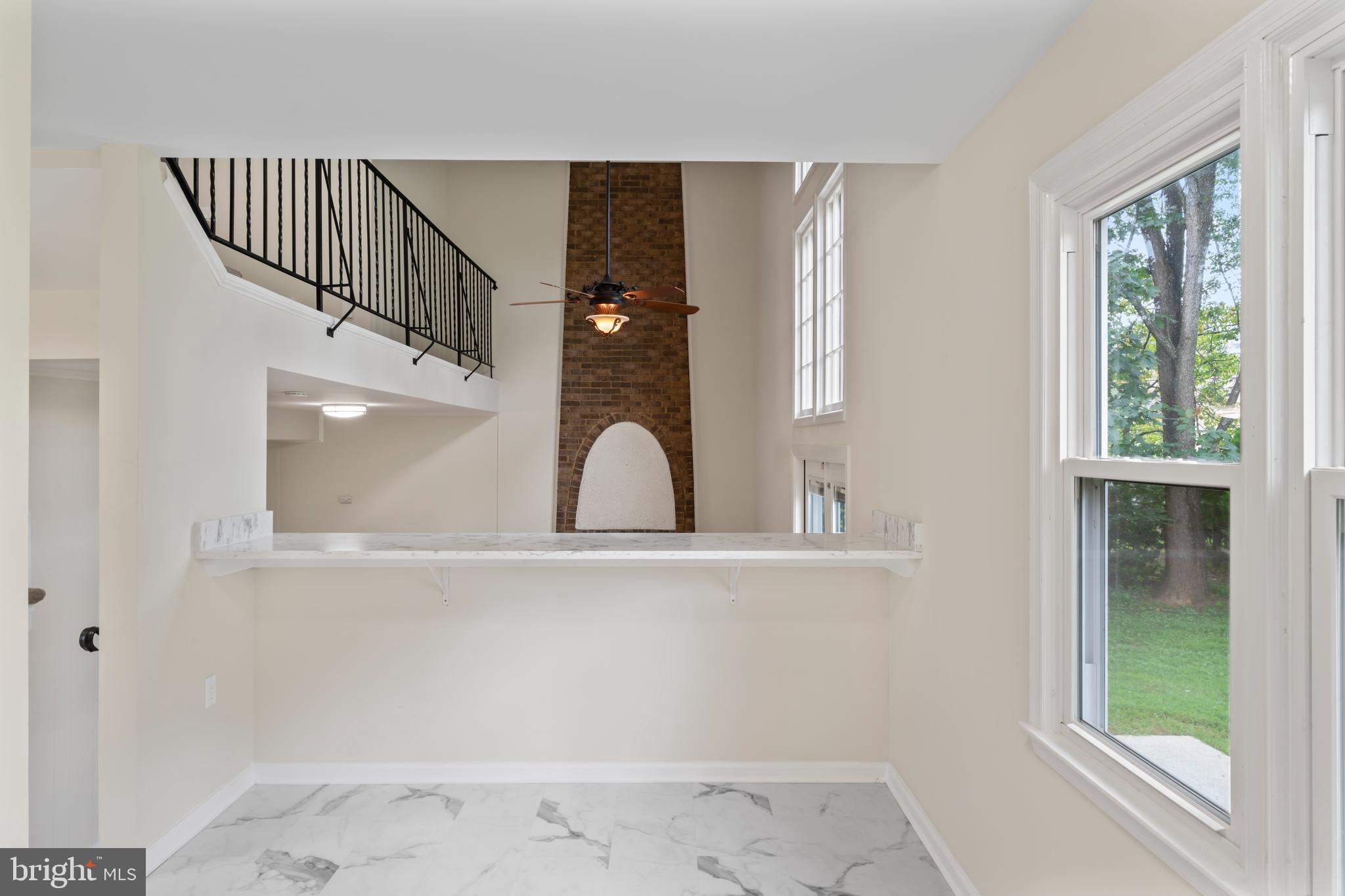 17004 Cashell Road Rockville, MD 20853 - Photo 16 of 80 a view of staircase with white walls and windows