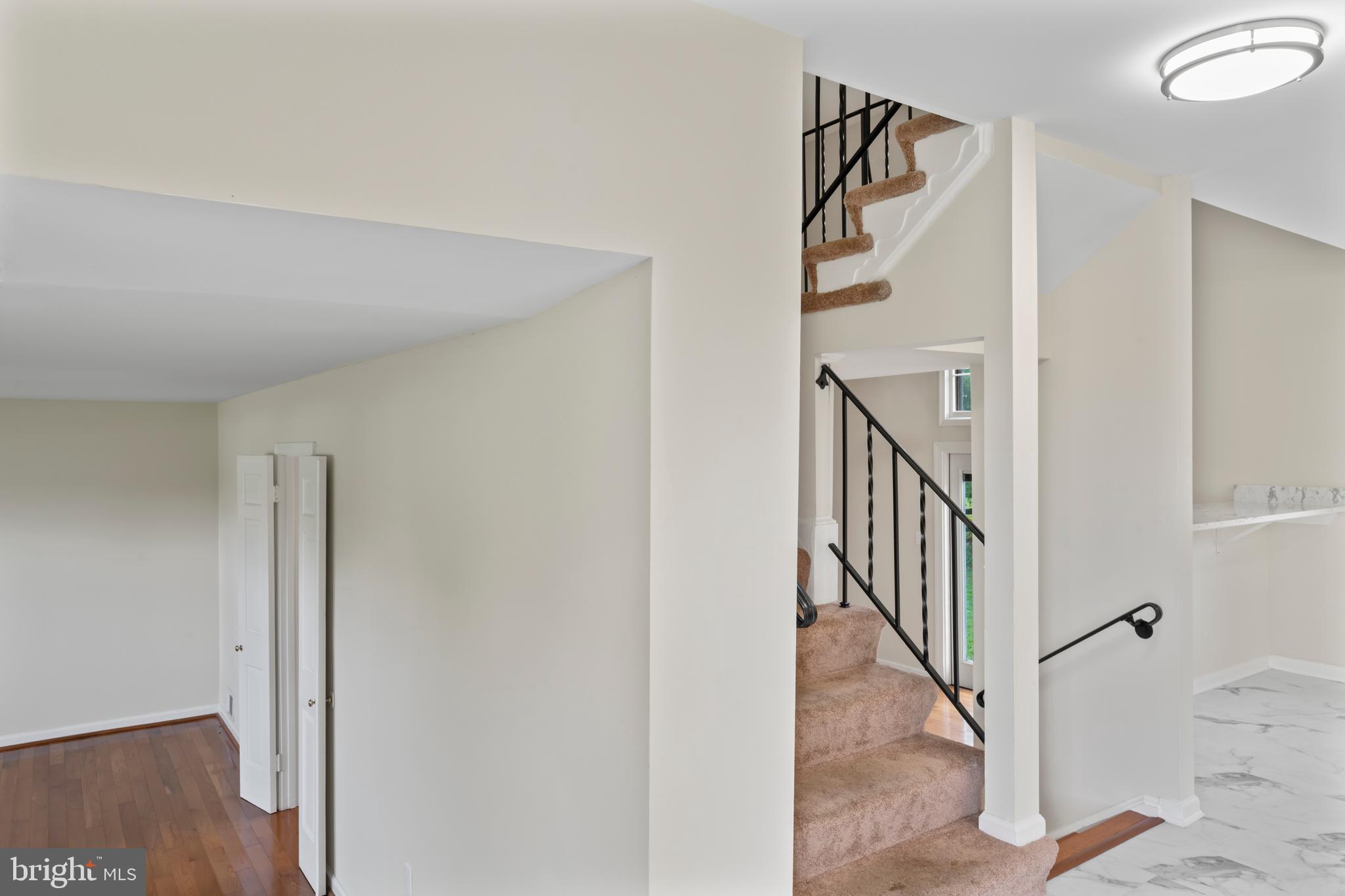 17004 Cashell Road Rockville, MD 20853 - Photo 31 of 80 a view of a hallway with wooden floor and entryway
