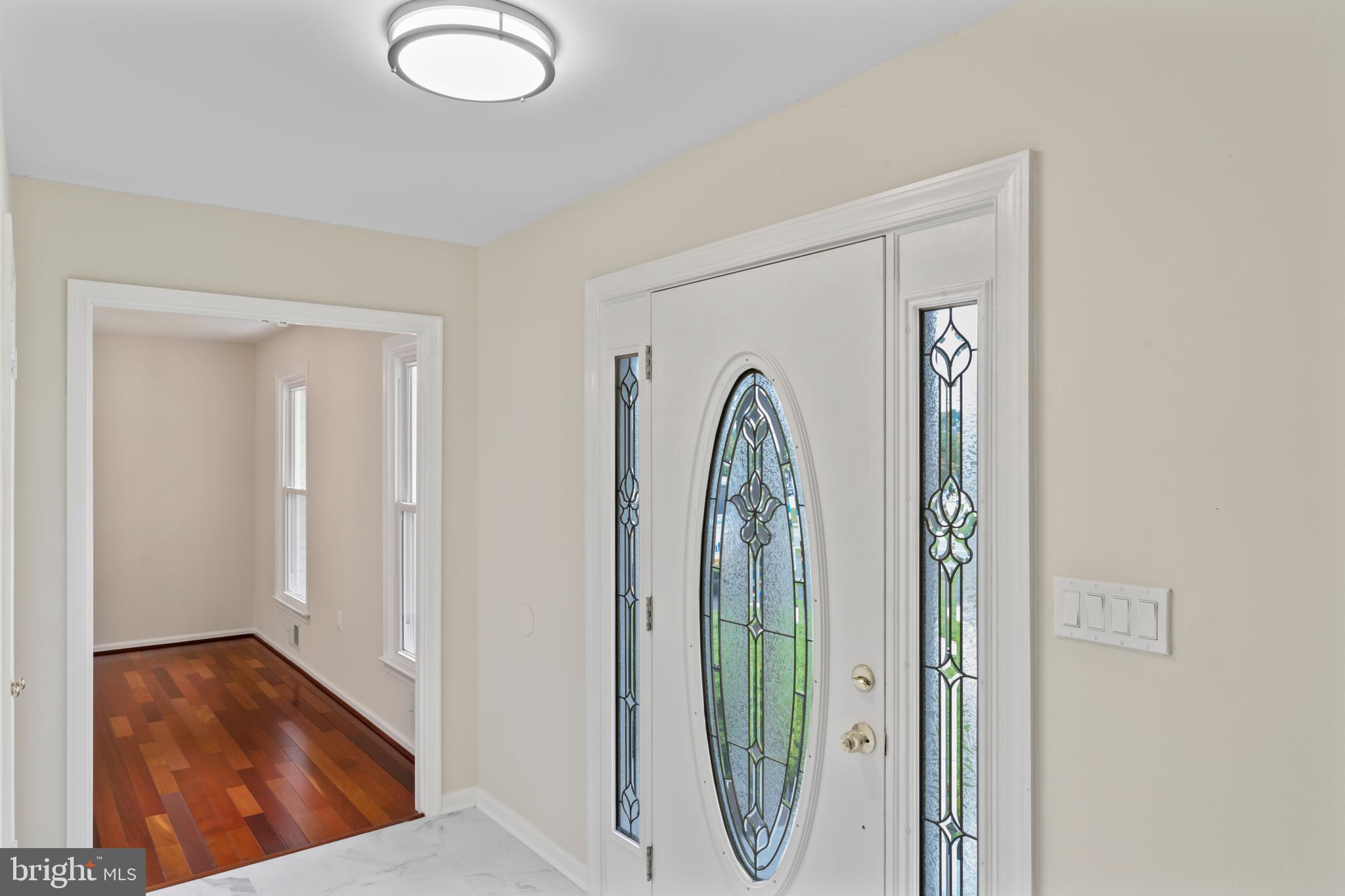 17004 Cashell Road Rockville, MD 20853 - Photo 4 of 80 a view of a livingroom with wooden floor and a window