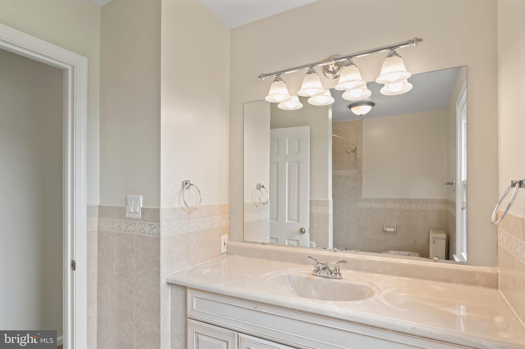 17004 Cashell Road Rockville, MD 20853 - Photo 44 of 80 a bathroom with a sink and a mirror