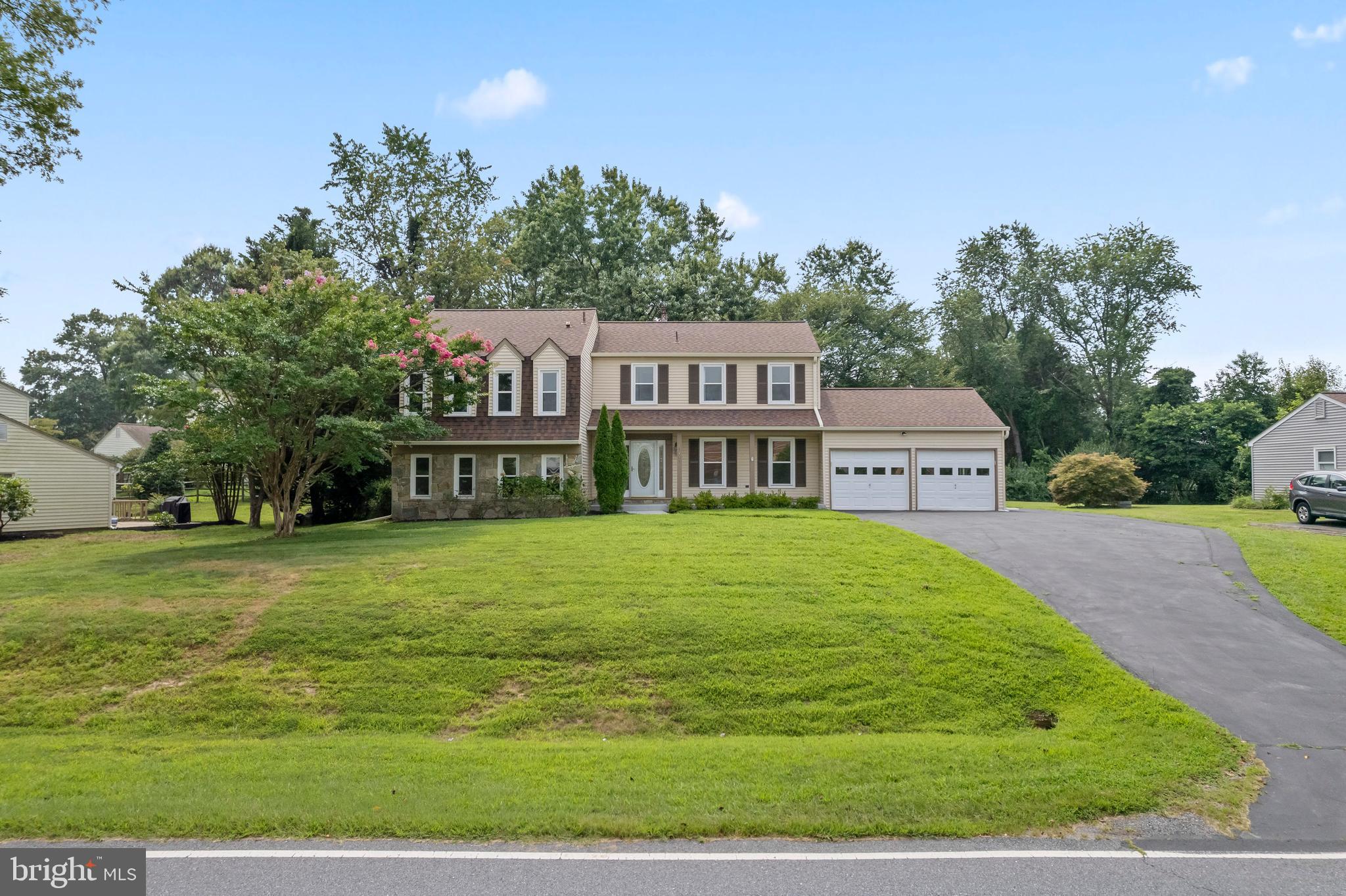 17004 Cashell Road Rockville, MD 20853 - Photo 64 of 80 a front view of a house with a garden