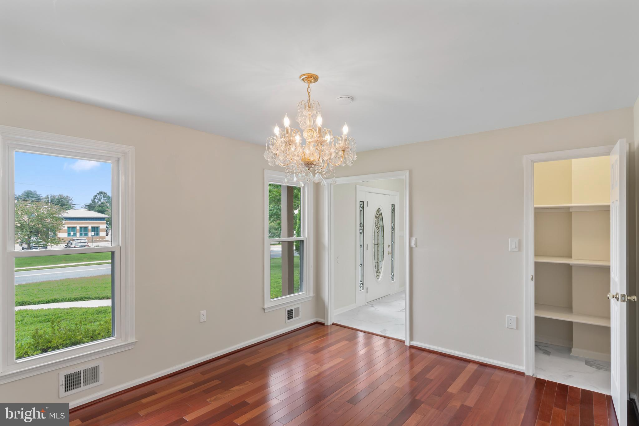 17004 Cashell Road Rockville, MD 20853 - Photo 8 of 80 a view of an empty room with wooden floor and a window