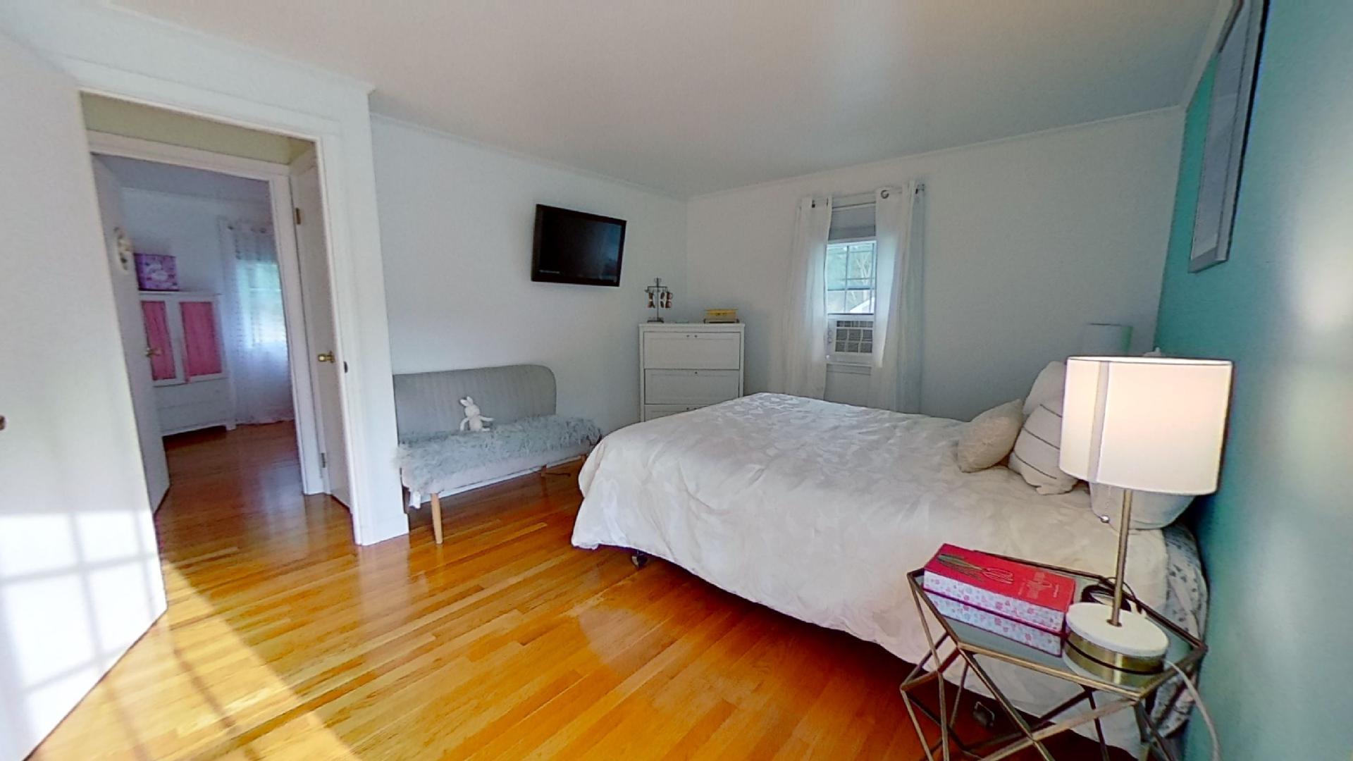 29 Padlock Lane Centerville, MA 02632 - Photo 14 of 33 a bedroom with a bed and wooden floor