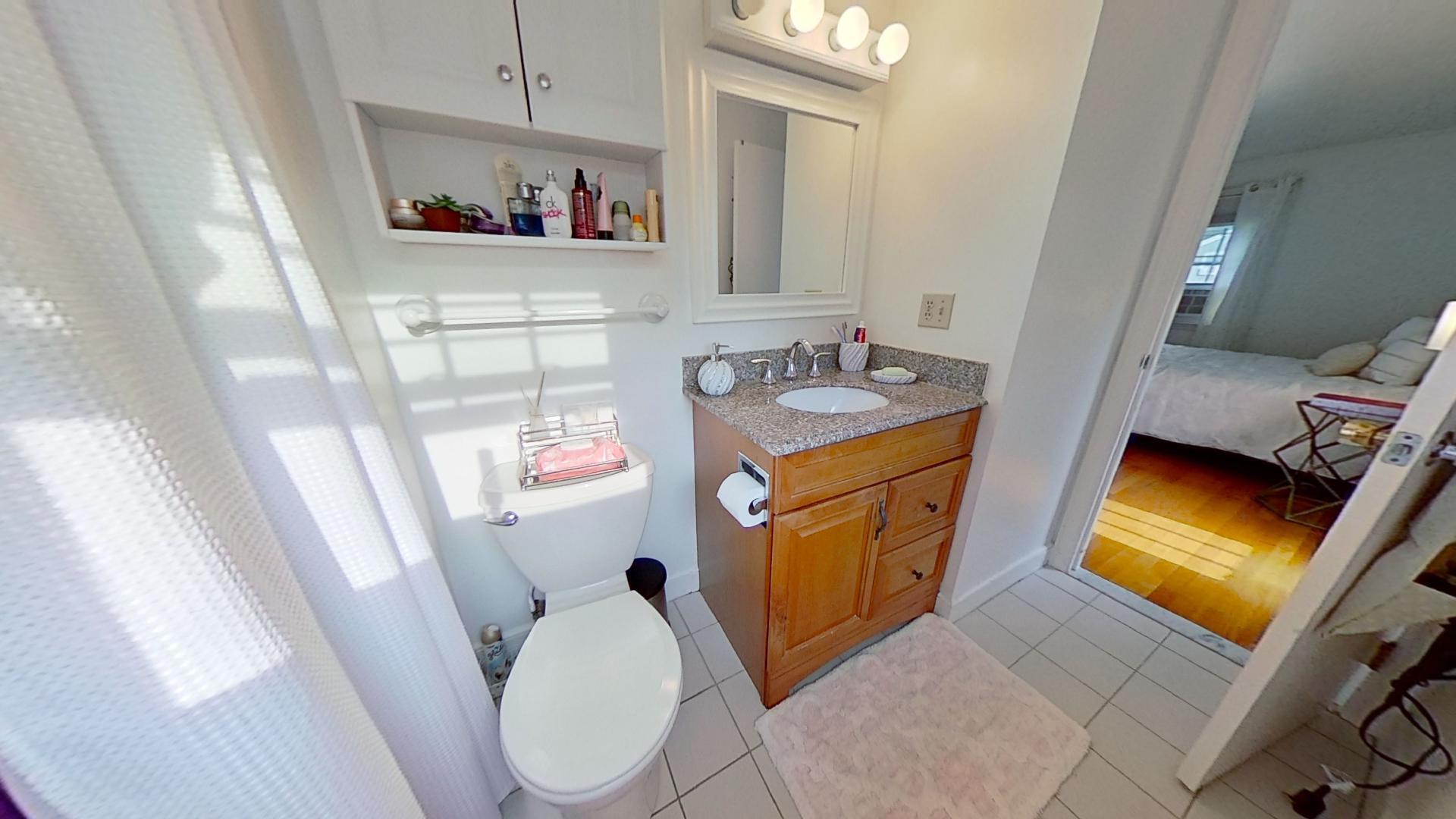 29 Padlock Lane Centerville, MA 02632 - Photo 16 of 33 a bathroom with a sink a mirror and a toilet