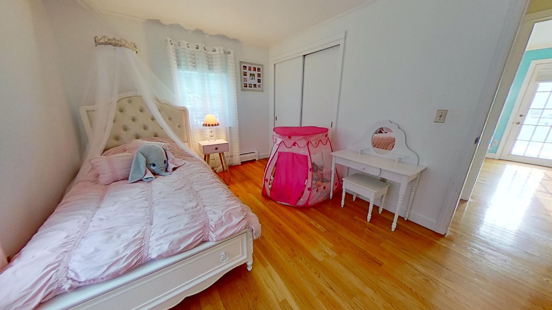 29 Padlock Lane Centerville, MA 02632 - Photo 20 of 33 a bedroom with a bed and wooden floor