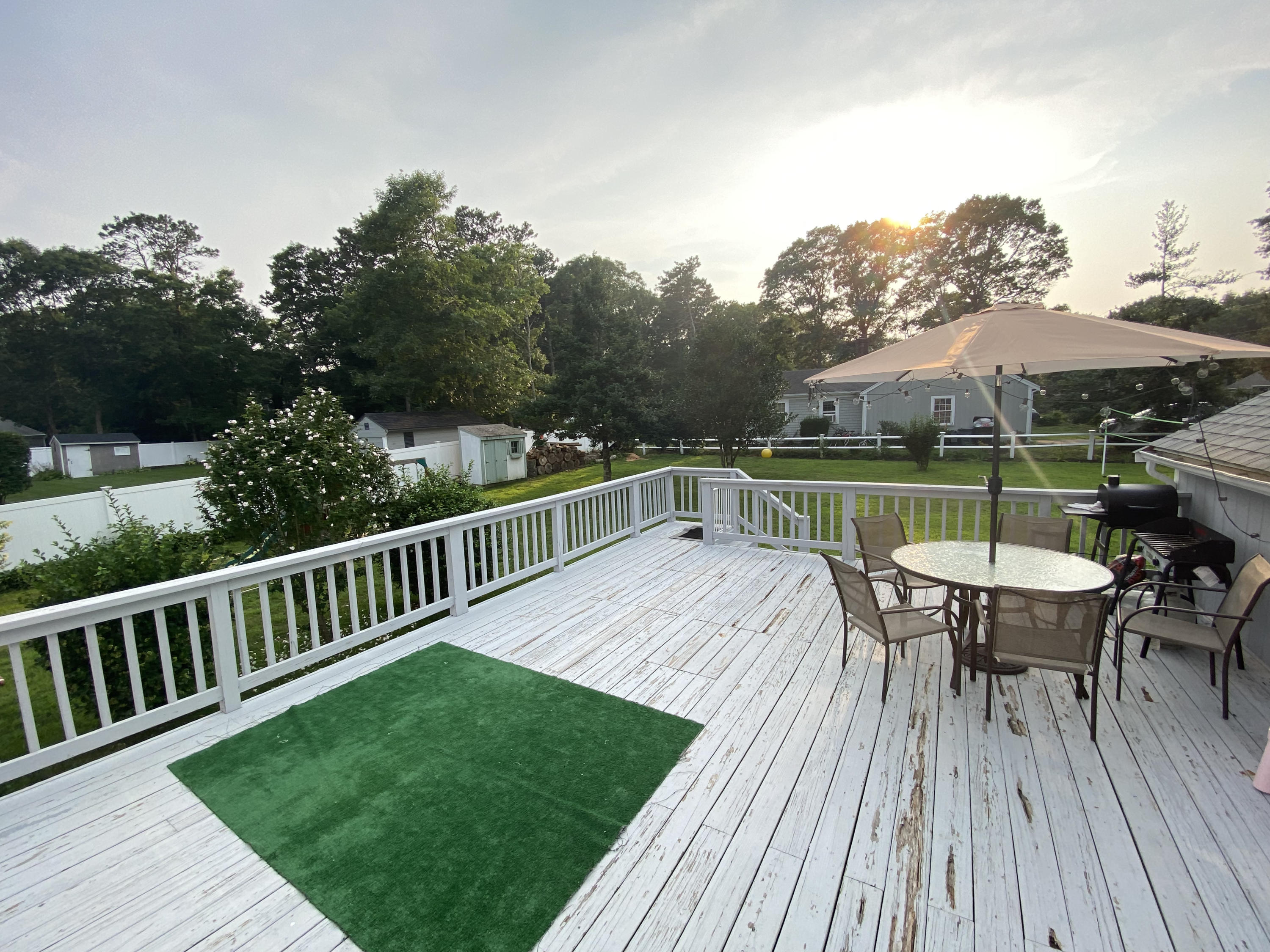 29 Padlock Lane Centerville, MA 02632 - Photo 24 of 33 a view of a deck with furniture and trees