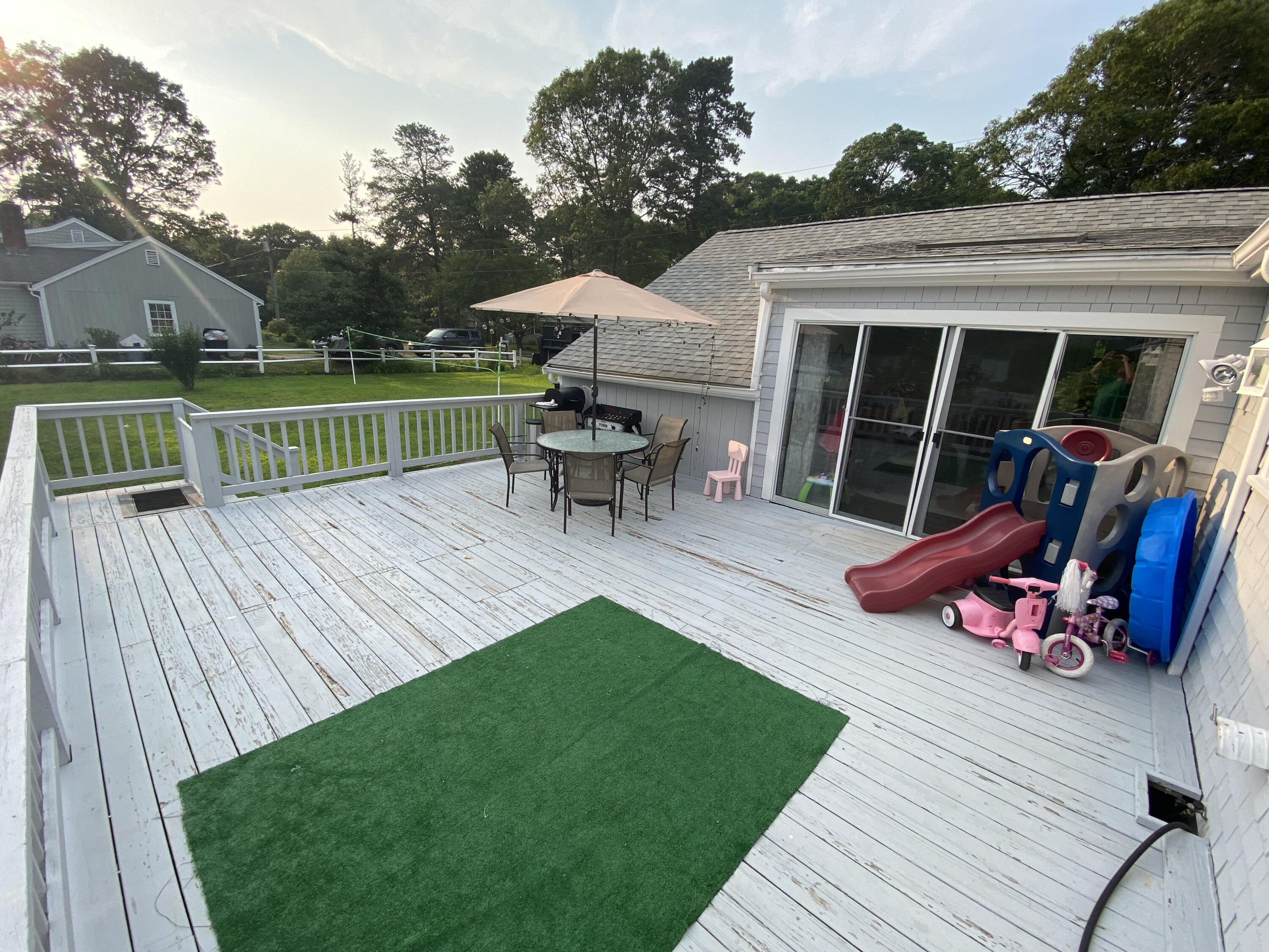 29 Padlock Lane Centerville, MA 02632 - Photo 25 of 33 a view of a house with a yard porch and sitting area
