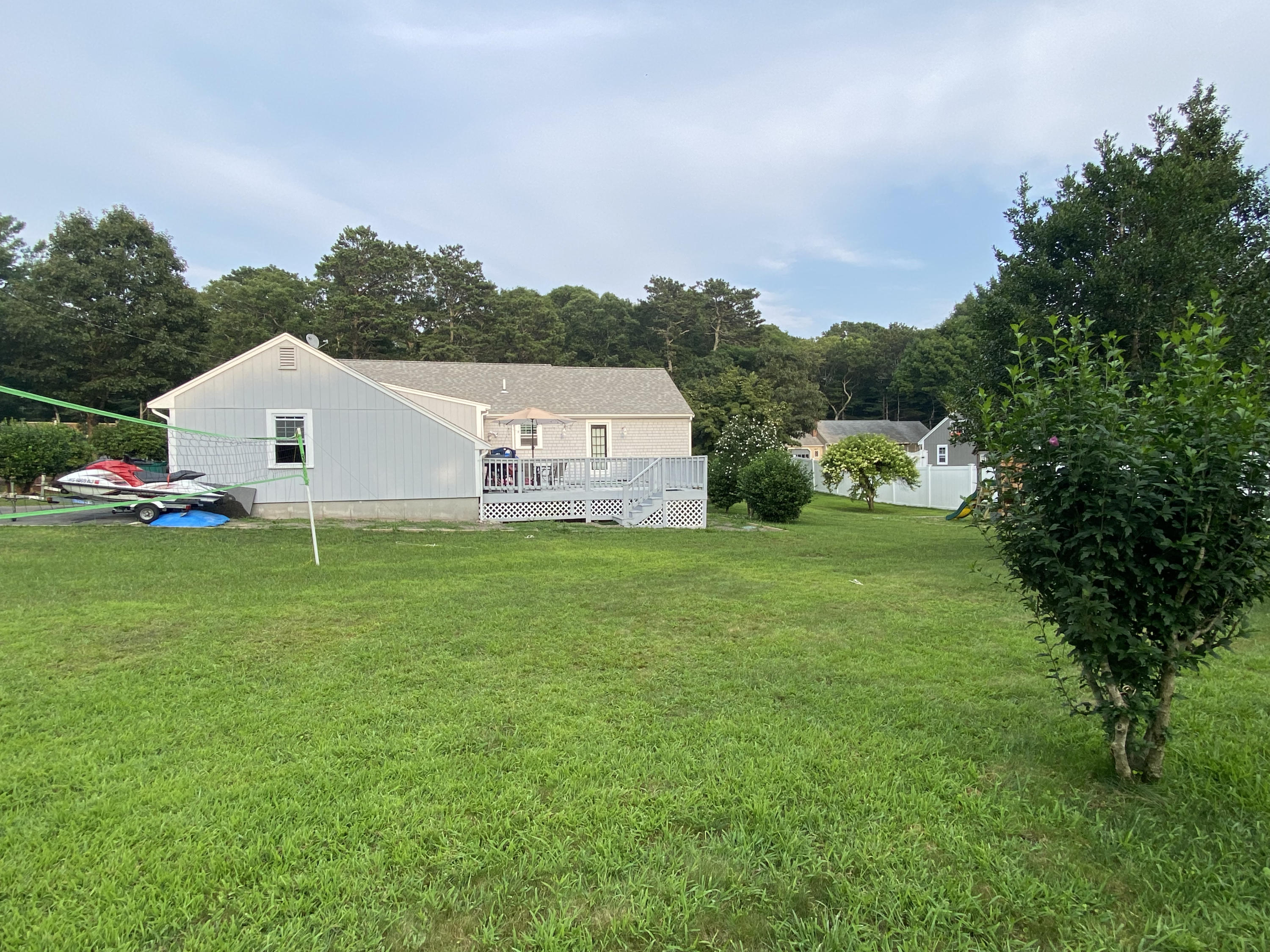 29 Padlock Lane Centerville, MA 02632 - Photo 28 of 33 a view of a house with a yard and sitting area