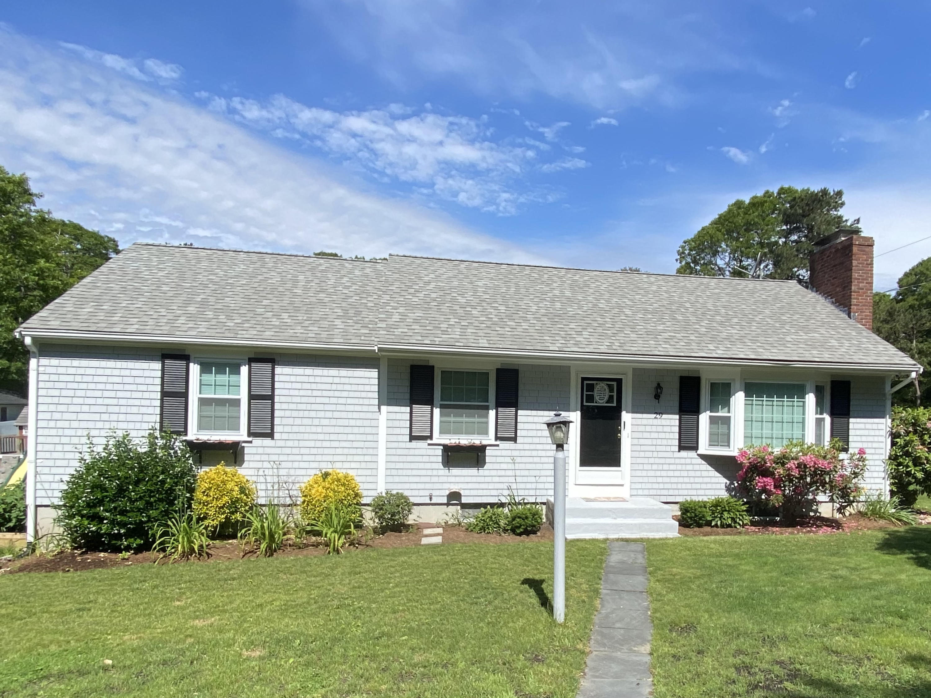 29 Padlock Lane Centerville, MA 02632 - Photo 30 of 33 a front view of a house with a yard