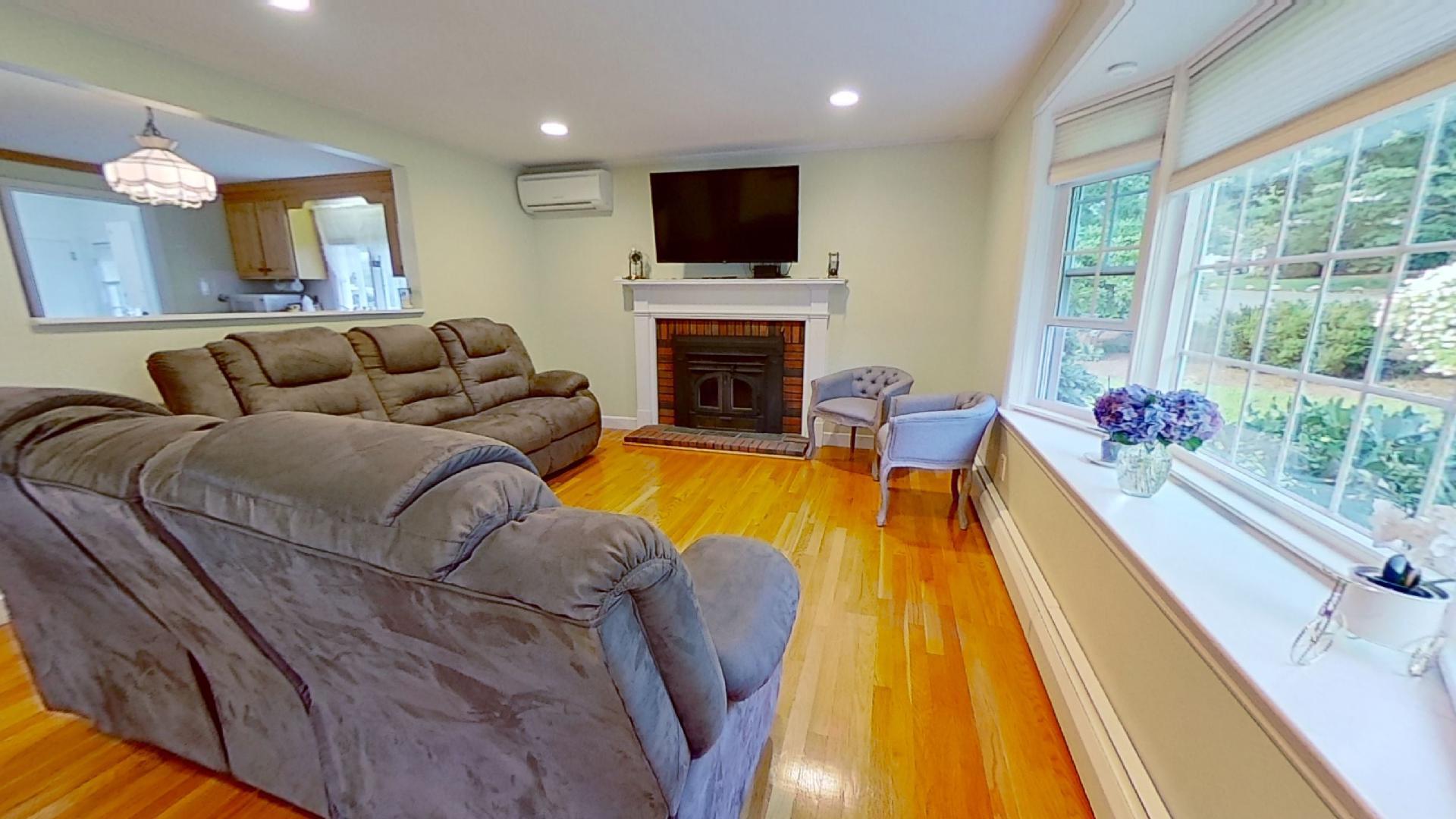 29 Padlock Lane Centerville, MA 02632 - Photo 3 of 33 a living room with furniture and a fireplace