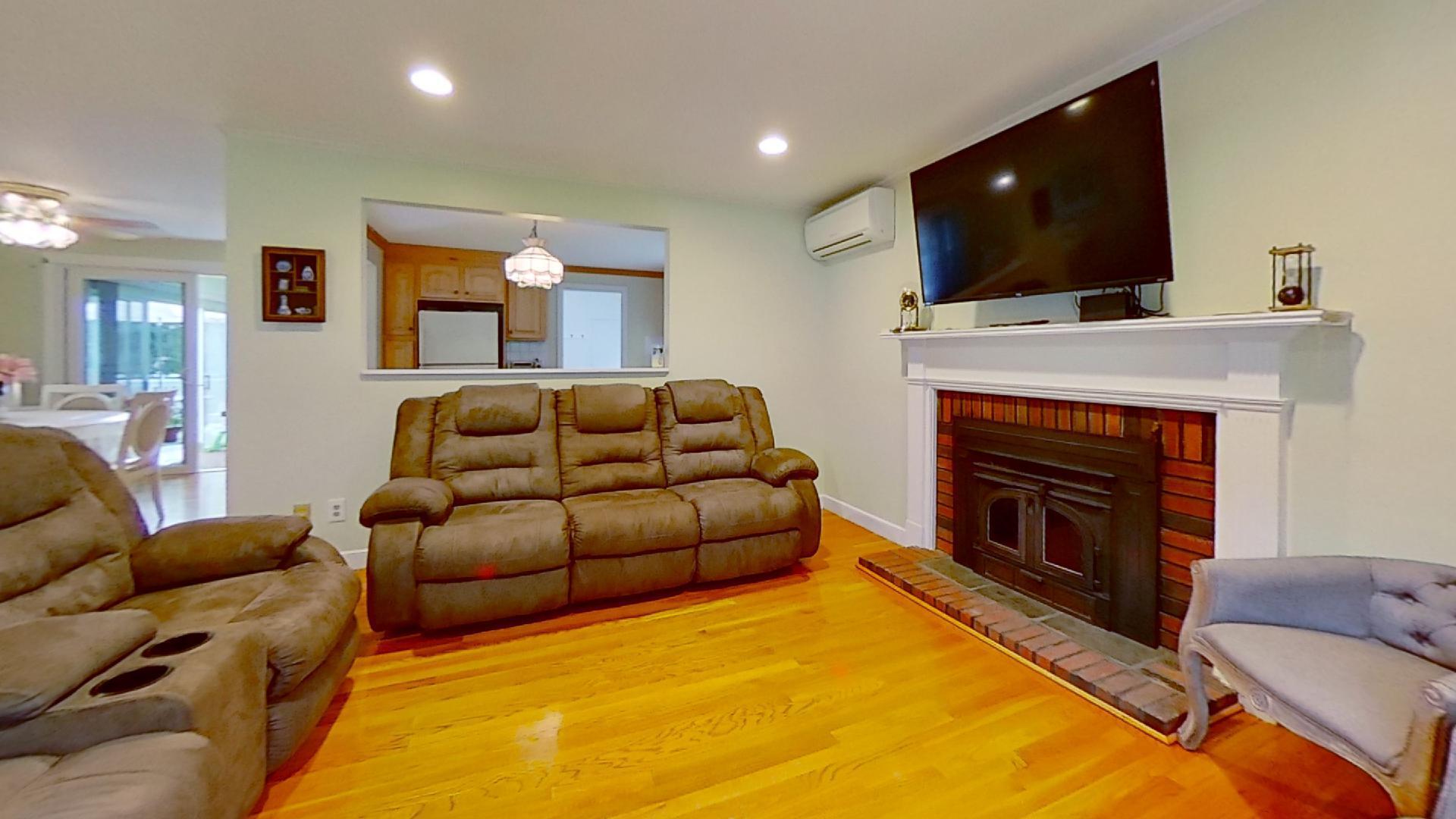 29 Padlock Lane Centerville, MA 02632 - Photo 5 of 33 a living room with furniture and a fireplace