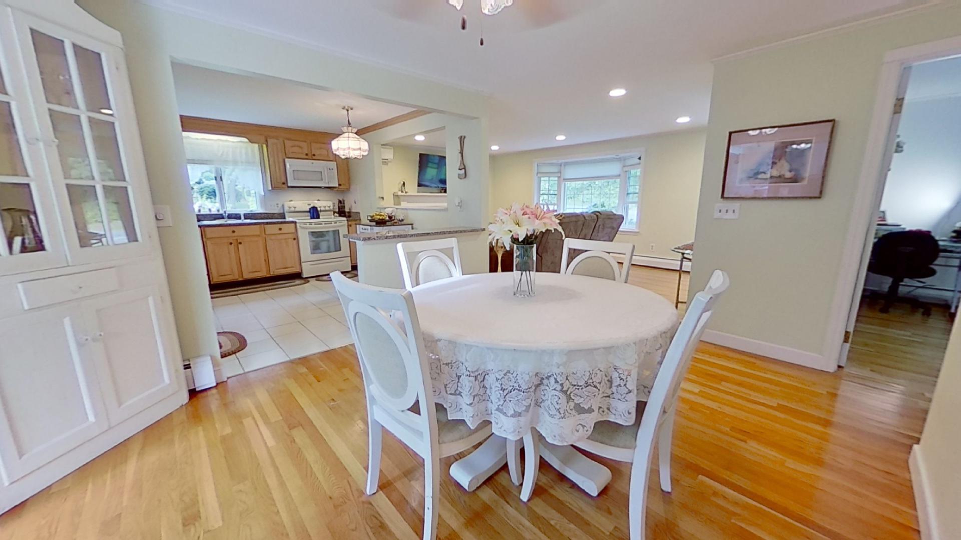 29 Padlock Lane Centerville, MA 02632 - Photo 6 of 33 a view of a dining room with furniture and wooden floor