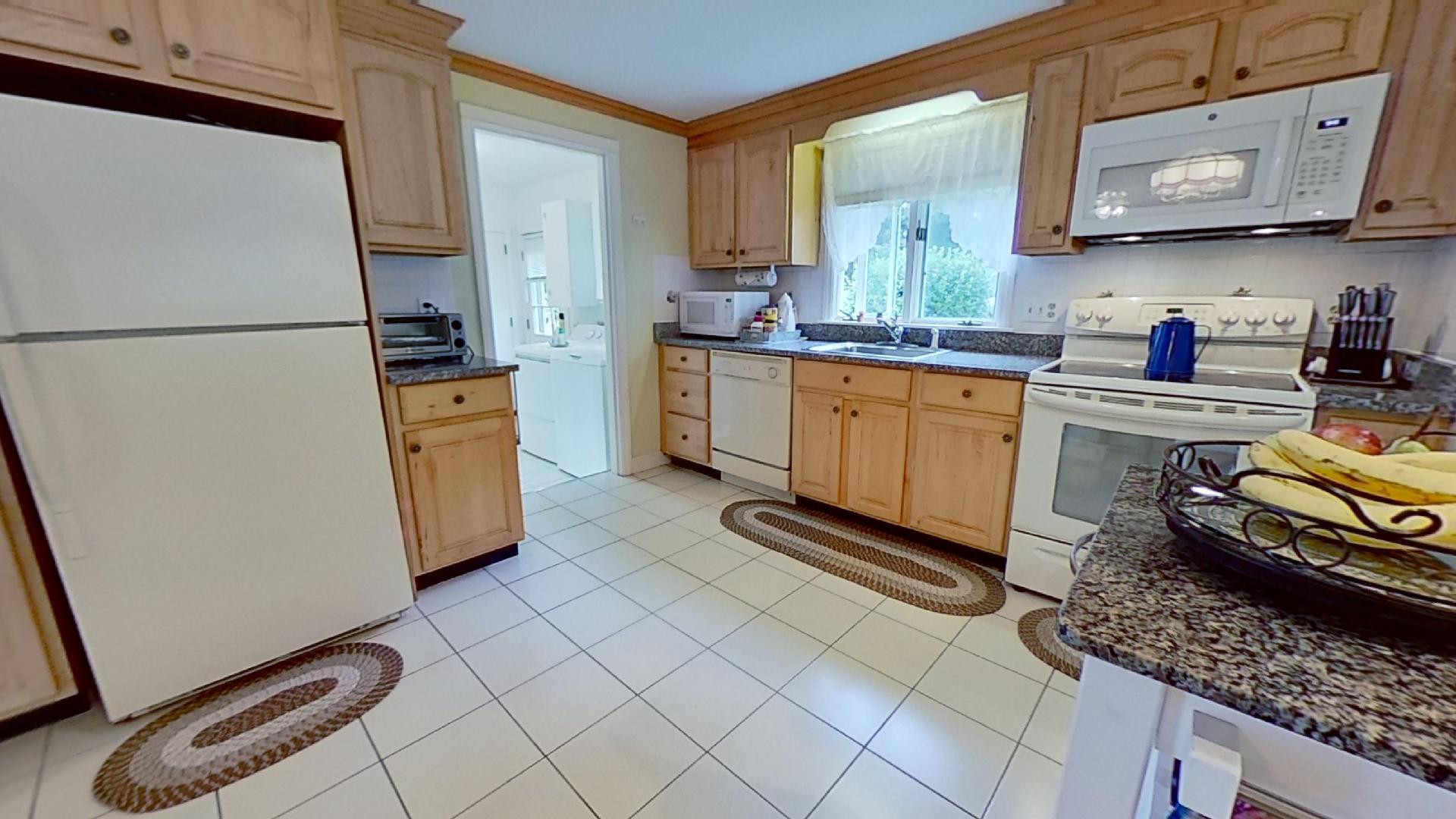 29 Padlock Lane Centerville, MA 02632 - Photo 7 of 33 a kitchen with stainless steel appliances a refrigerator sink and stove