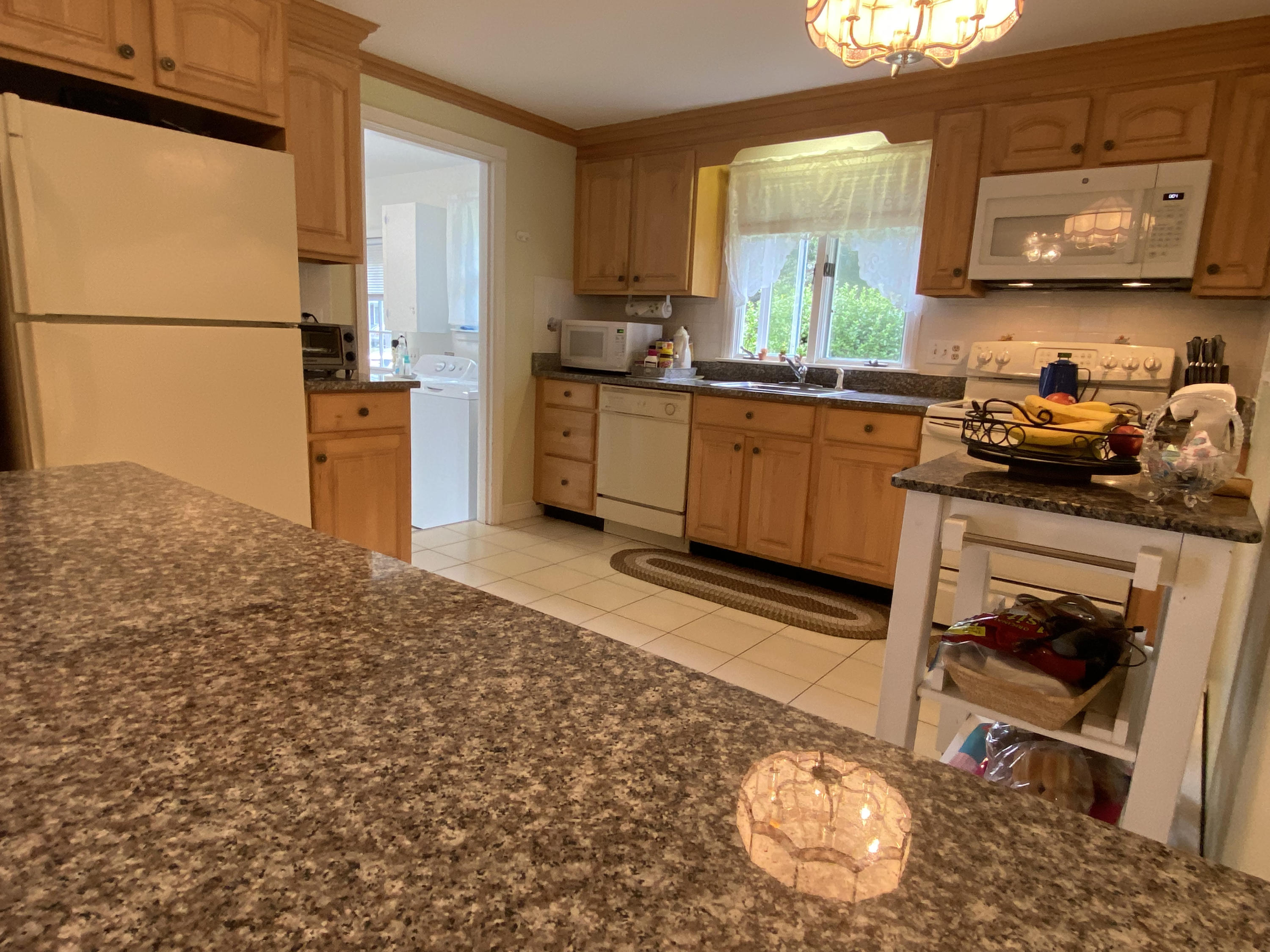 29 Padlock Lane Centerville, MA 02632 - Photo 10 of 33 a kitchen with stainless steel appliances granite countertop a sink stove and cabinets