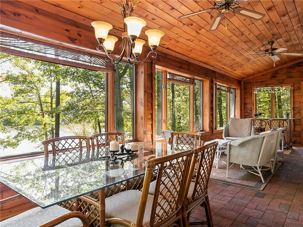 1641 Concord Church Road Roxboro, NC 27574 - Photo 11 of 30 a view of a dining room with furniture large windows and wooden floor