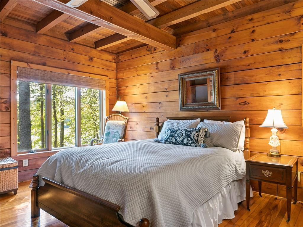 1641 Concord Church Road Roxboro, NC 27574 - Photo 21 of 30 a bedroom with a bed and wooden floor
