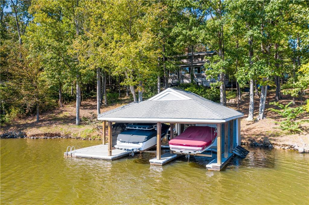 1641 Concord Church Road Roxboro, NC 27574 - Photo 9 of 30 a view of pool with lawn chairs under an umbrella