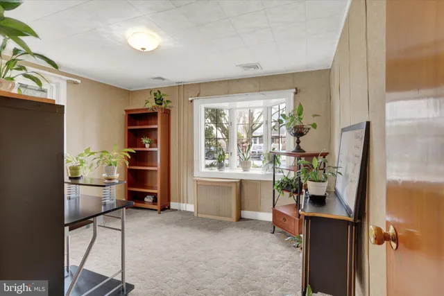 a room with furniture a window and walk in closet