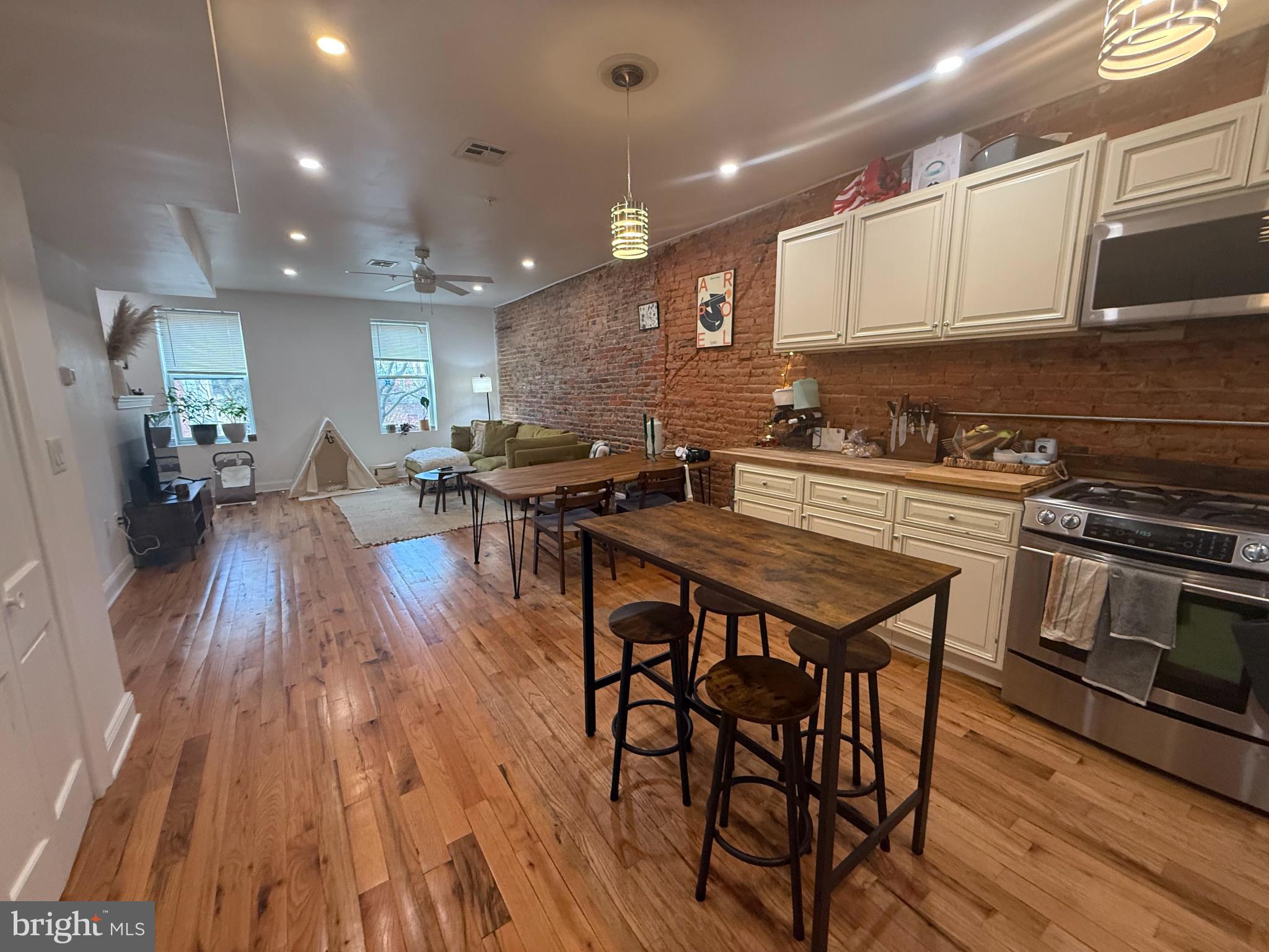 an open kitchen with a table and chairs in it