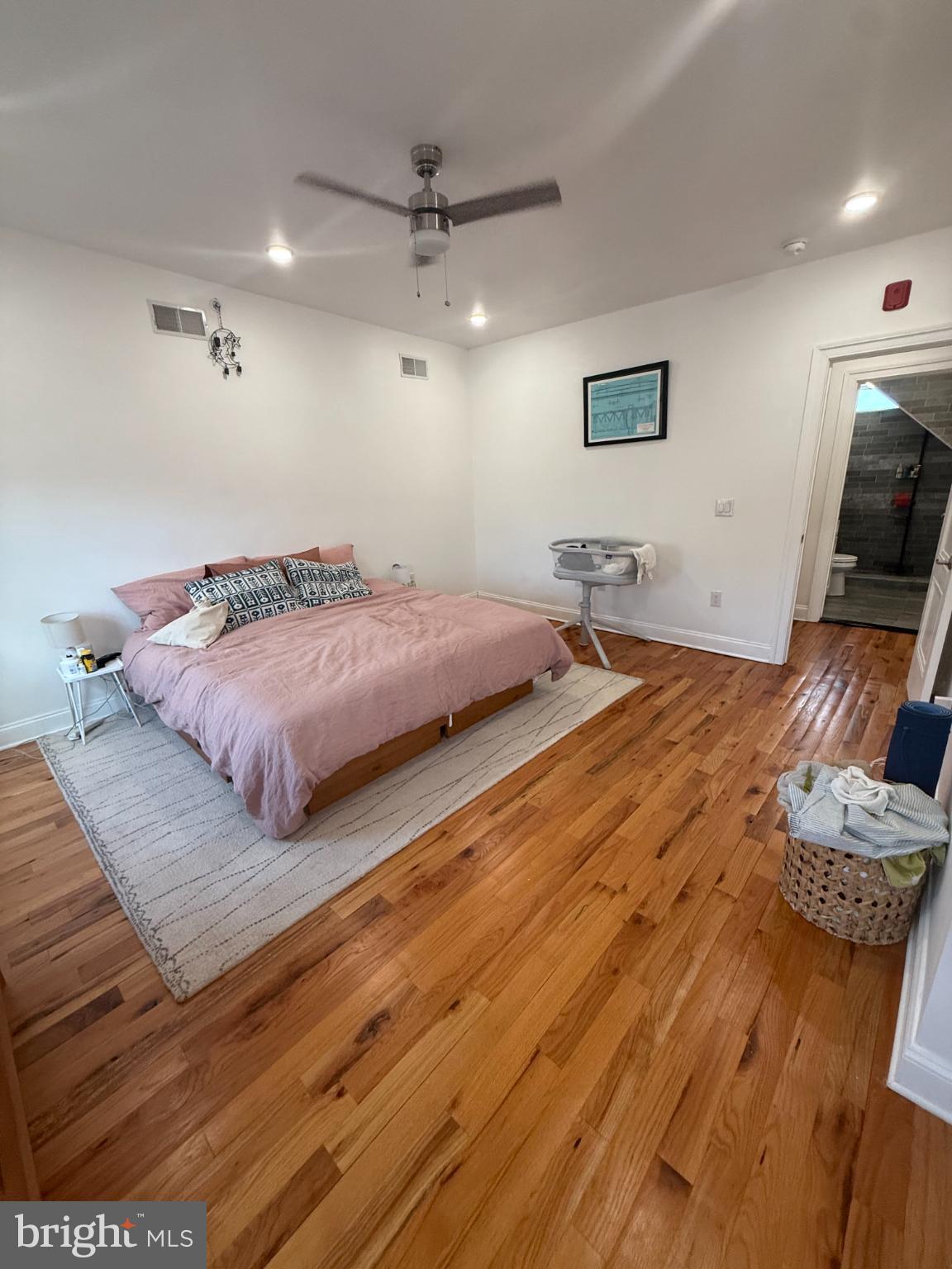 2005 North Mascher Street, Unit B Philadelphia, PA 19122 - Photo 20 of 31 a bedroom with a bed and a flat screen tv