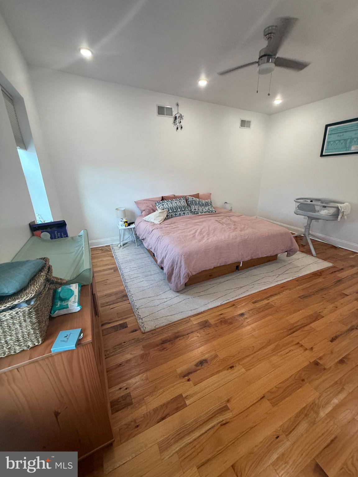 2005 North Mascher Street, Unit B Philadelphia, PA 19122 - Photo 21 of 31 a spacious bedroom with a bed and a dresser in it