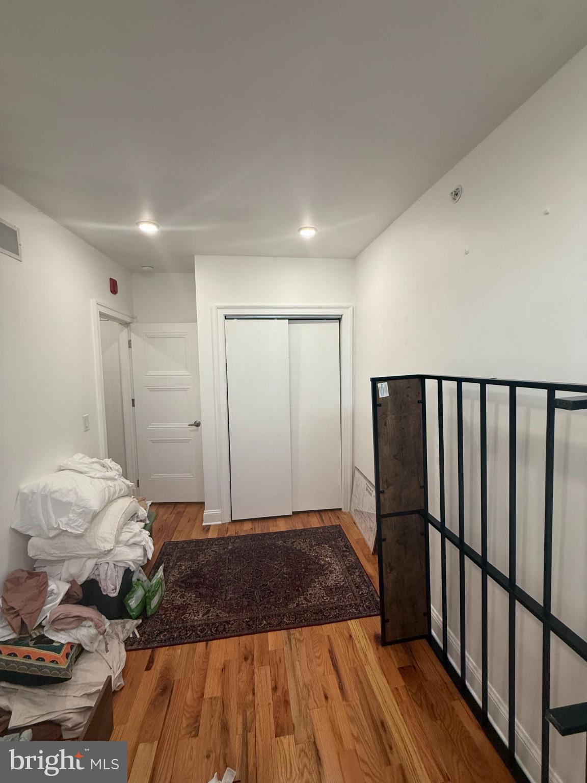 2005 North Mascher Street, Unit B Philadelphia, PA 19122 - Photo 23 of 31 a spacious bedroom with a bed and wooden floor