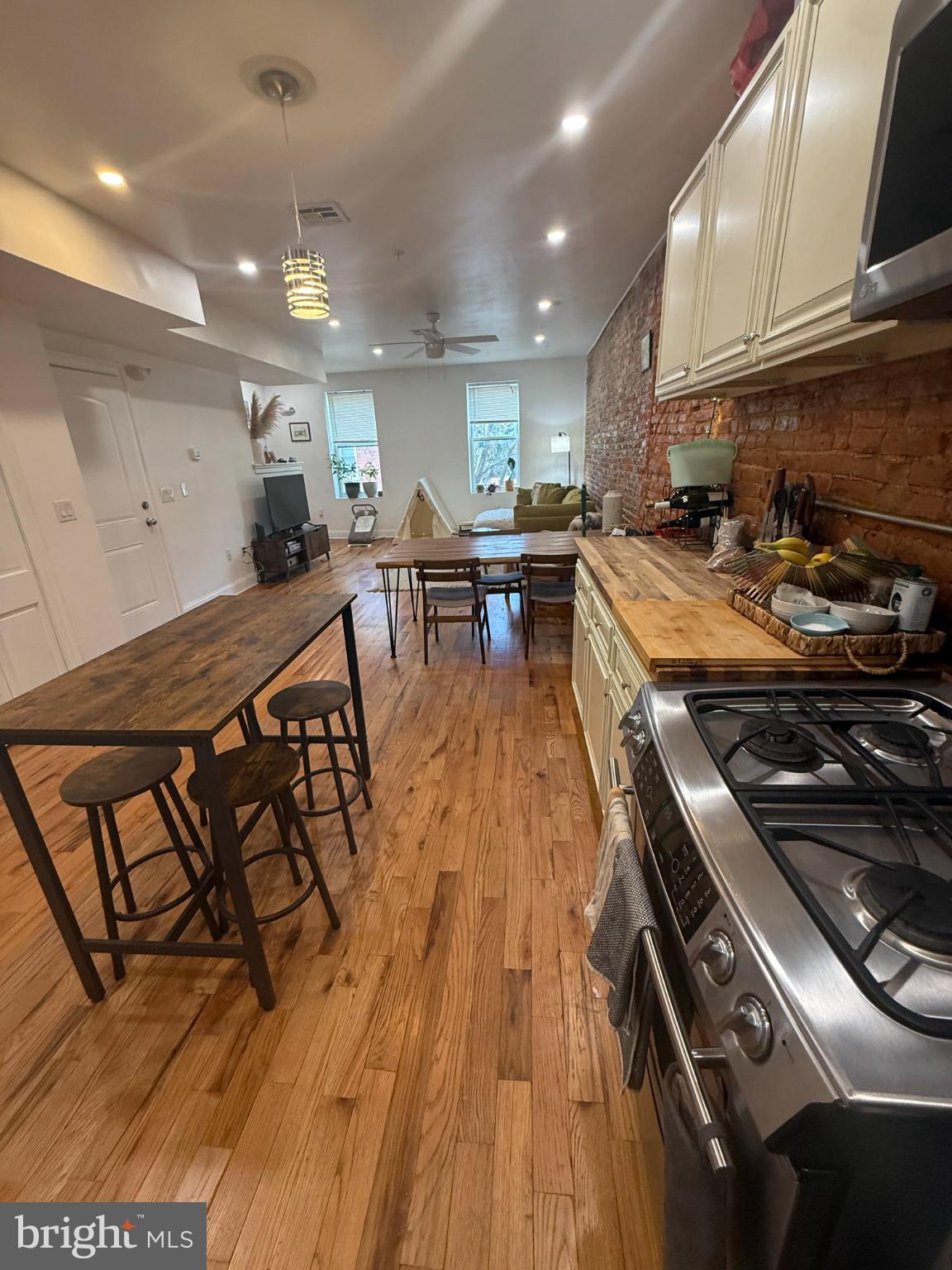 2005 North Mascher Street, Unit B Philadelphia, PA 19122 - Photo 3 of 31 a kitchen with stainless steel appliances granite countertop a stove and a wooden floors