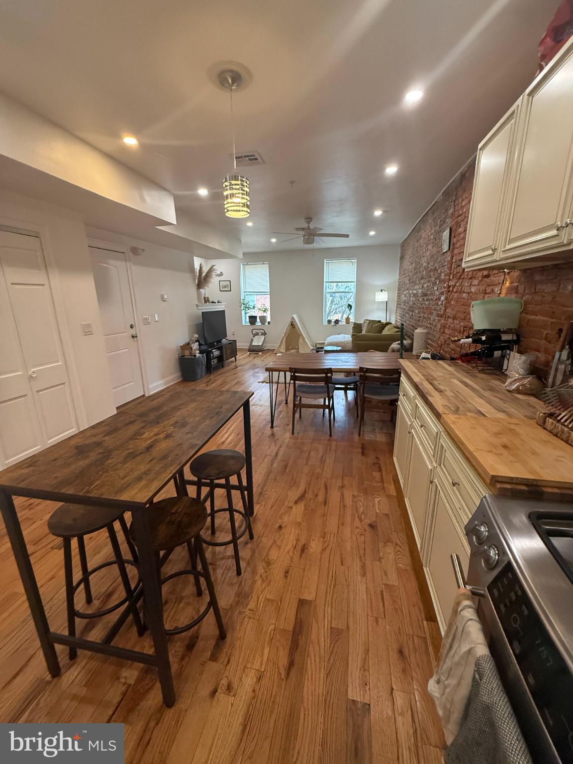 2005 North Mascher Street, Unit B Philadelphia, PA 19122 - Photo 4 of 31 a kitchen with a table chairs stove and cabinets