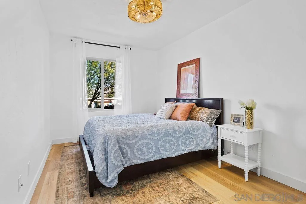 8722 Wahl Street Santee, CA 92071 - Photo 11 of 35 a bedroom with a bed and window