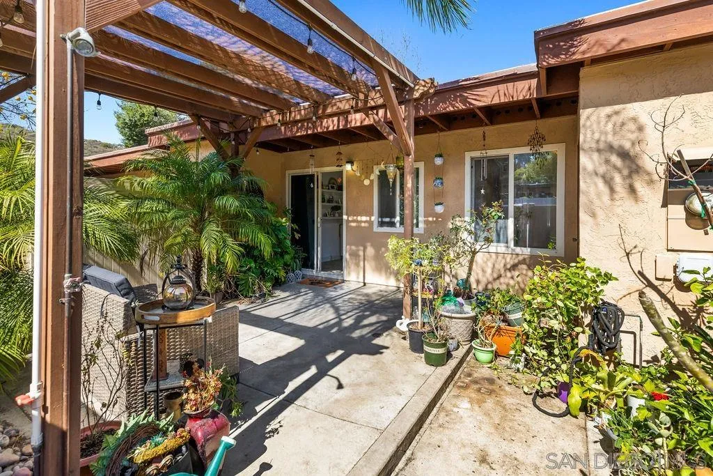 8722 Wahl Street Santee, CA 92071 - Photo 21 of 35 a view of a patio with table and chairs and potted plants