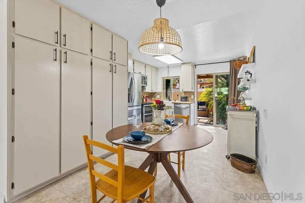 8722 Wahl Street Santee, CA 92071 - Photo 5 of 35 a view of a dining room with furniture and a chandelier