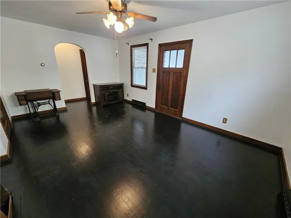 a view of a livingroom with furniture and a chandelier