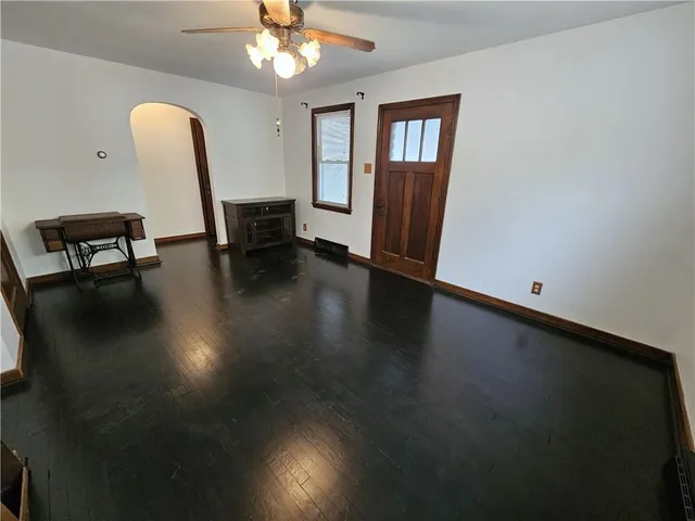 a view of a livingroom with furniture and a chandelier
