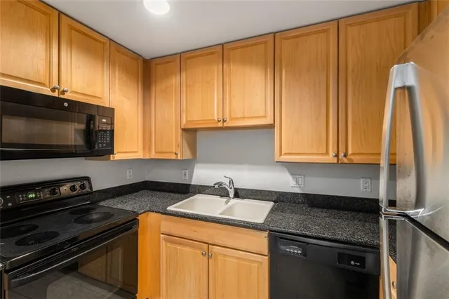 a white refrigerator freezer sitting in a kitchen