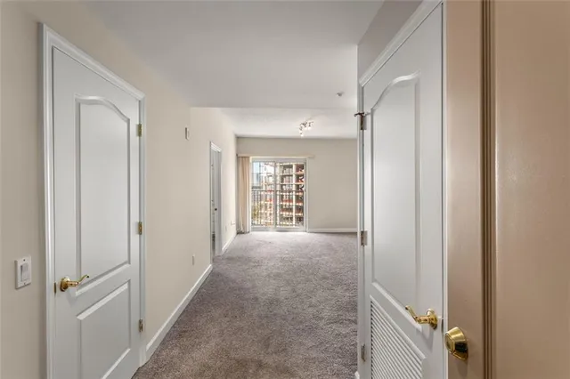 a view of livingroom with hardwood floor and white wall