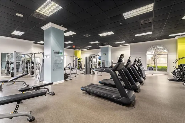 a kitchen with a refrigerator and a sink