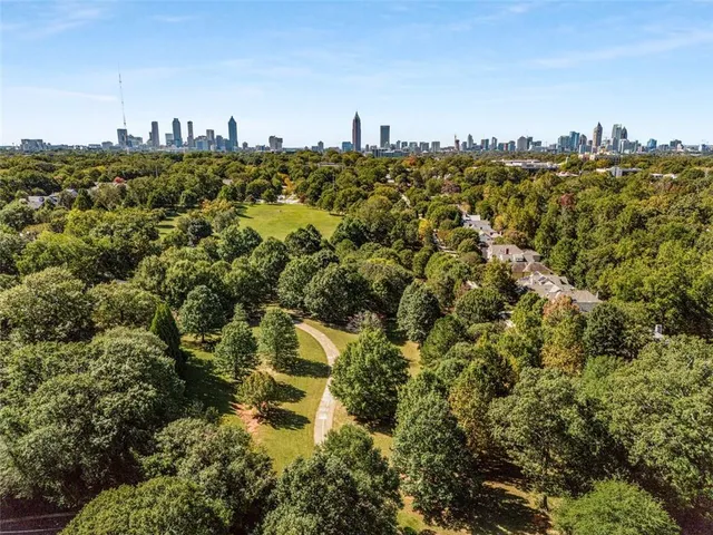 a view of a swimming pool with a yard