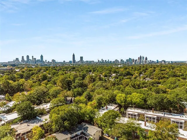 a large body of water with a building in the background