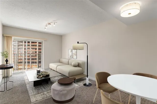 a room with furniture and a large window